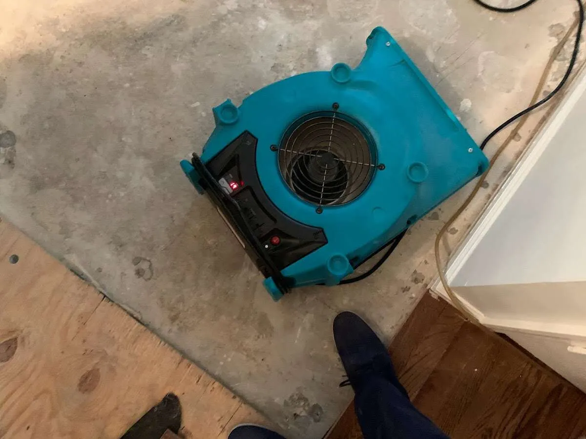 Air mover drying subfloor during Leak Detection & Repair in Kaiminani